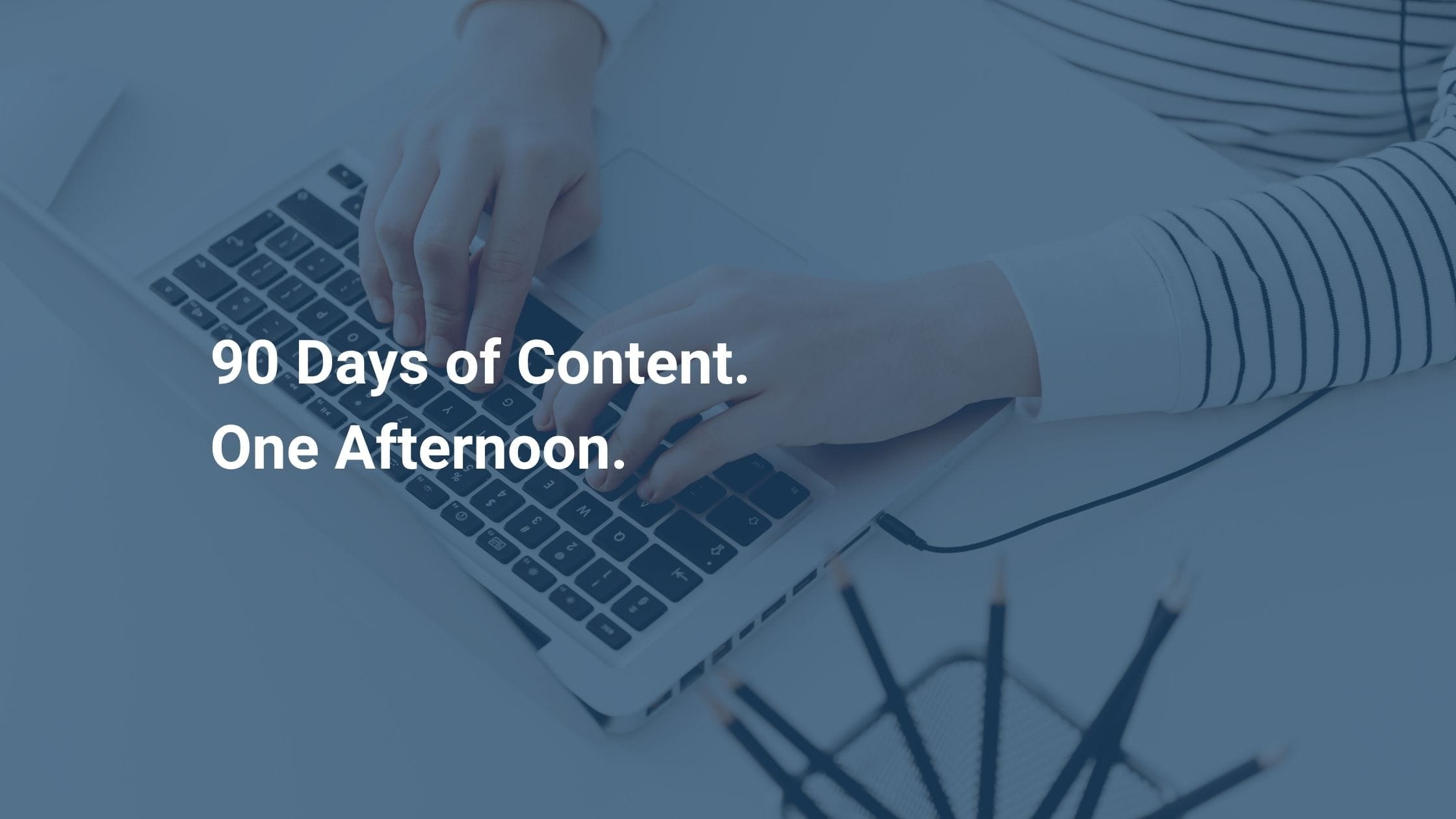 text overlay: create 90 days of content in one afternoon - person typing at computer